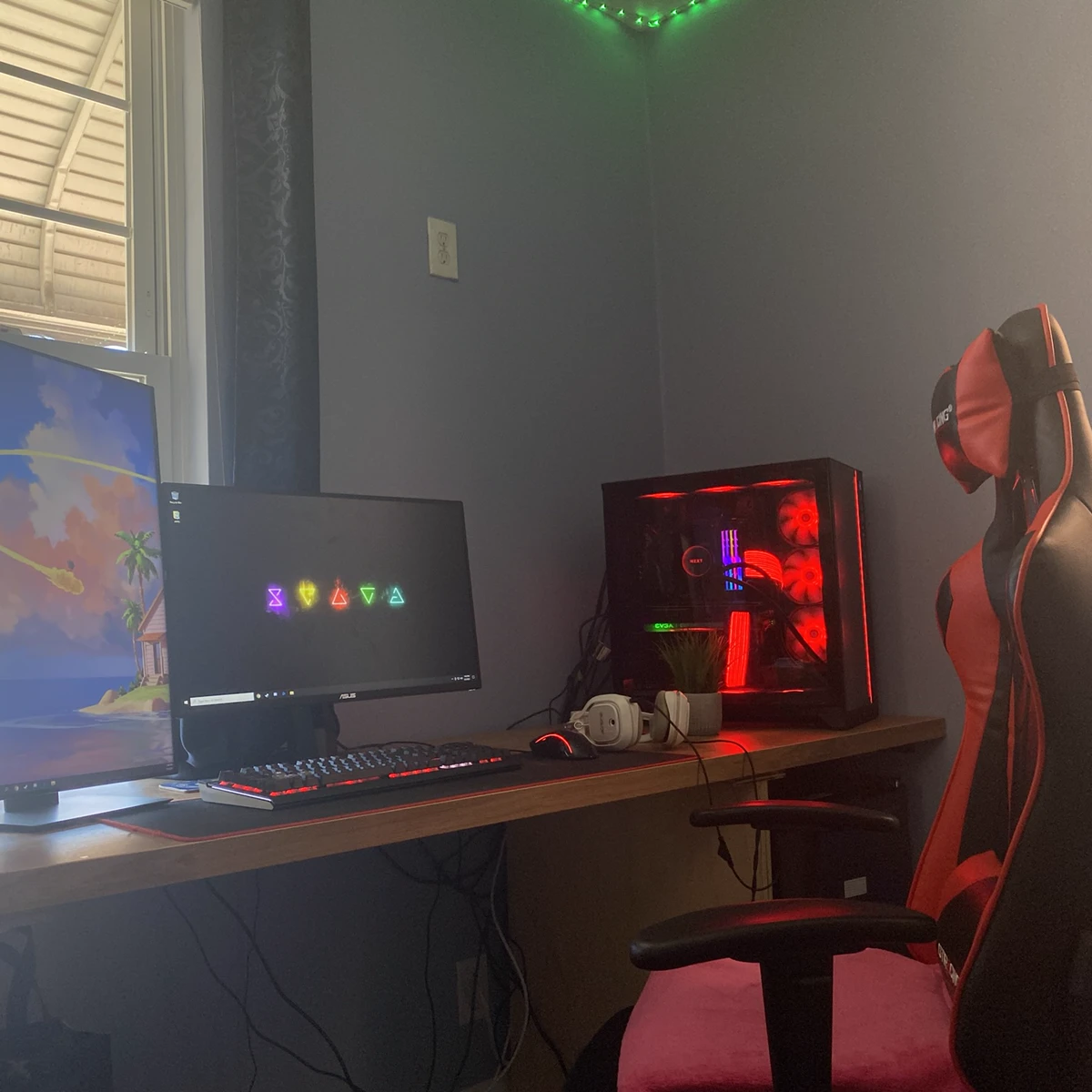 Completed custom gaming PC setup with dual monitors and RGB lighting